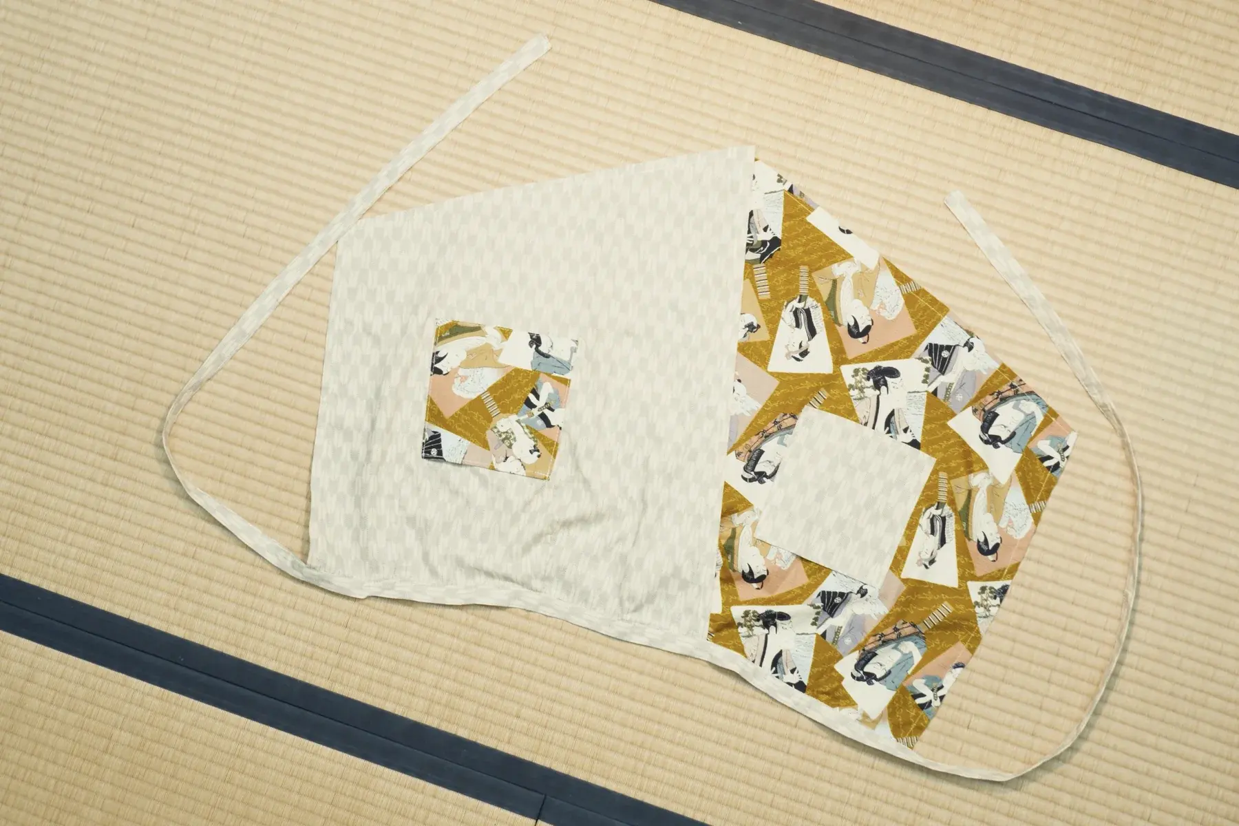 Ukiyo — White arrow-feather weave with a panel of figures on gold.